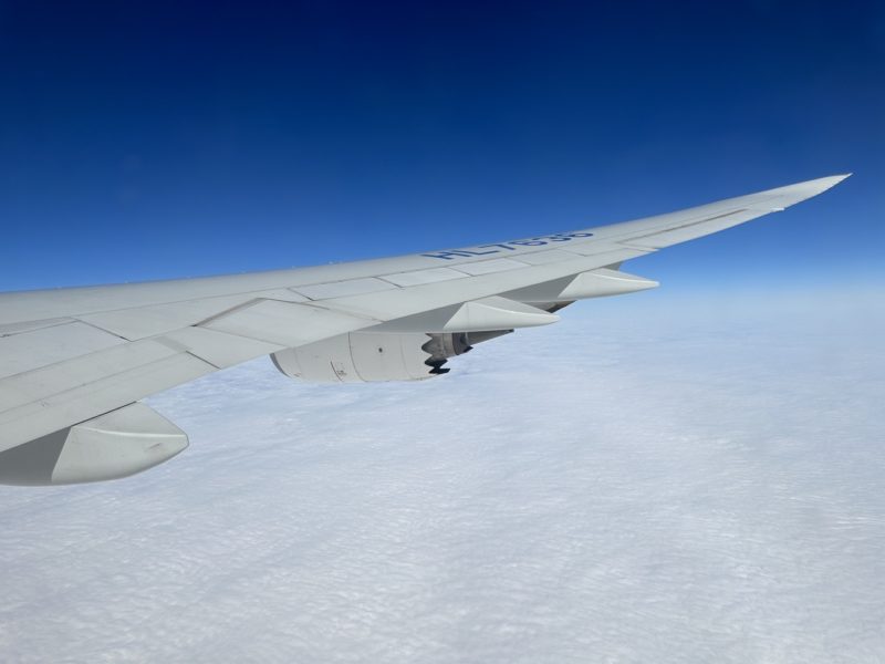 an airplane wing in the sky