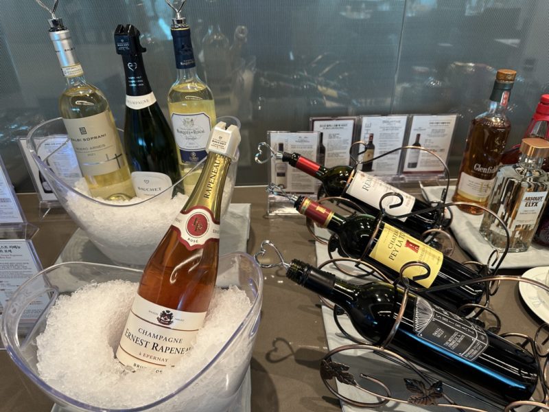 a group of bottles of wine in buckets