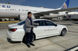 a man standing next to a car