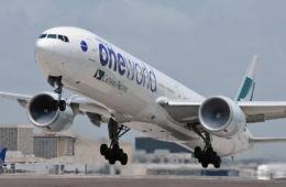 a large white airplane taking off