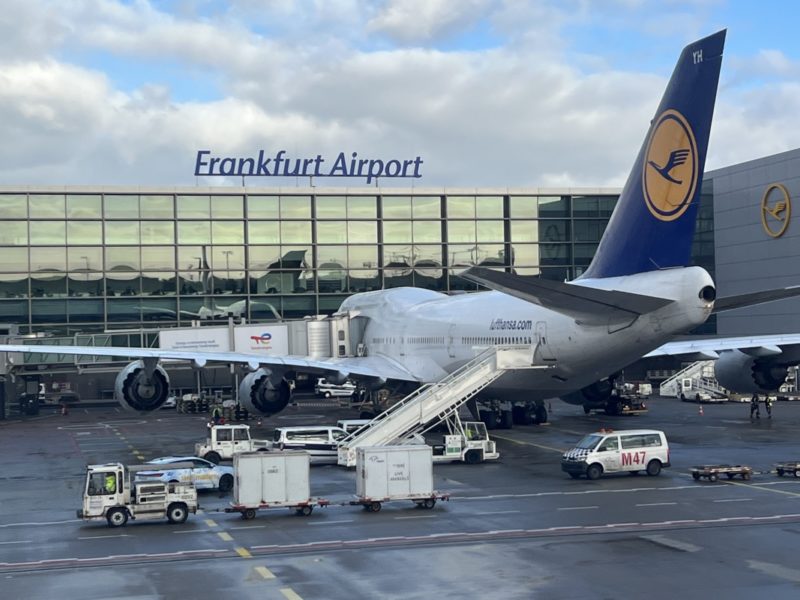 a plane parked in front of a building