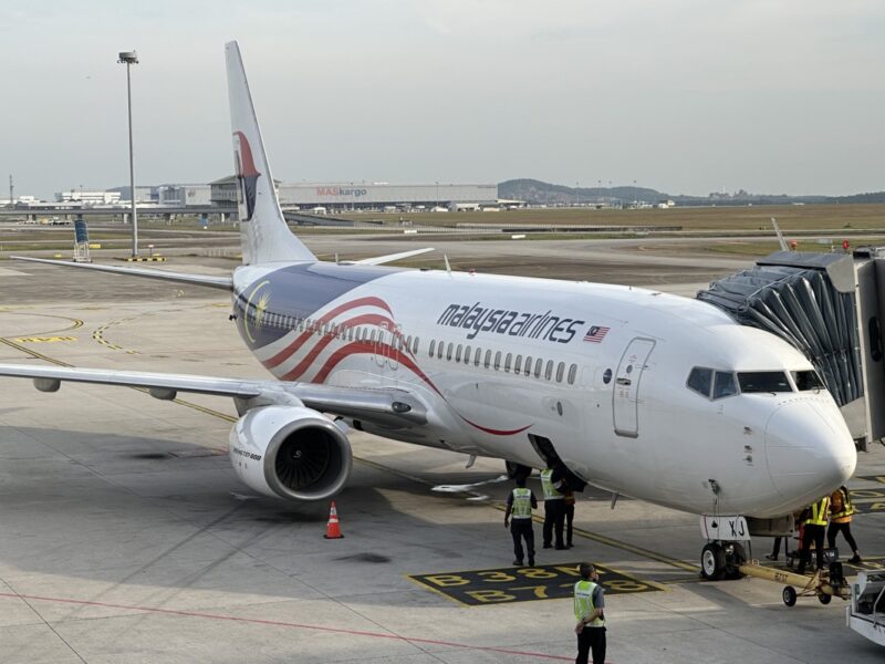 a white airplane on a tarmac