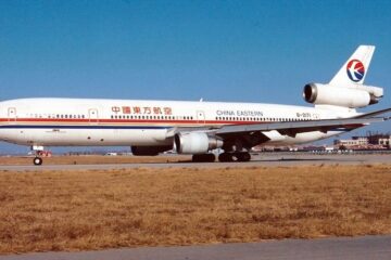 a white airplane on a runway