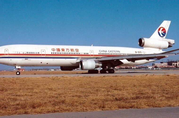 a white airplane on a runway