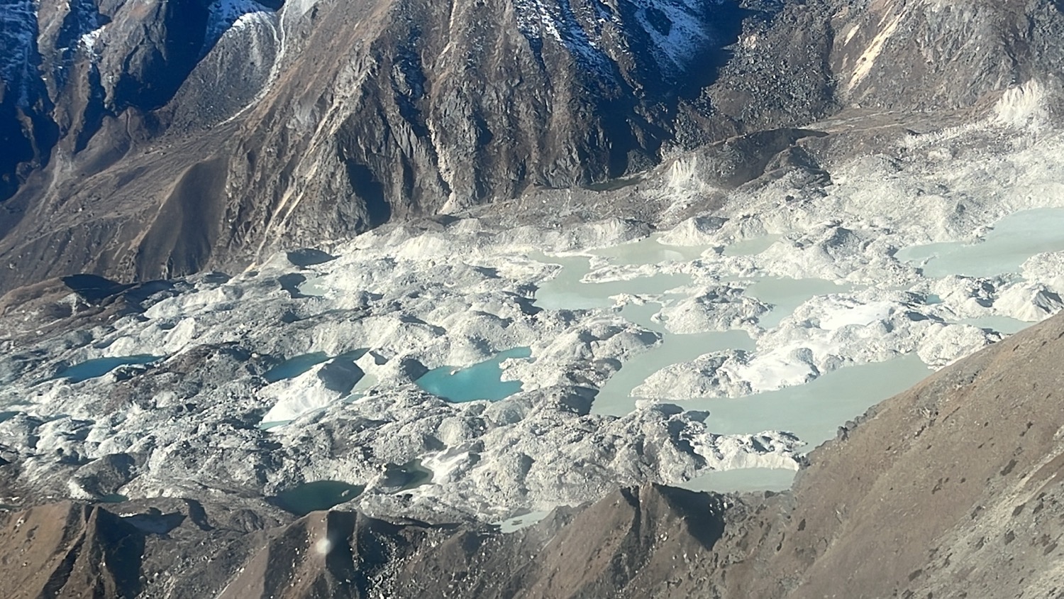 a mountain with snow and water