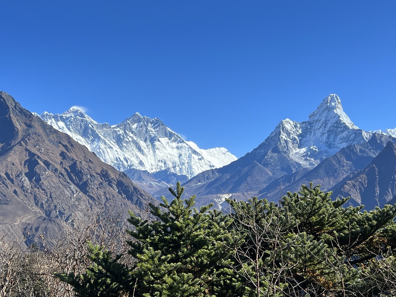 a snowy mountain range with trees