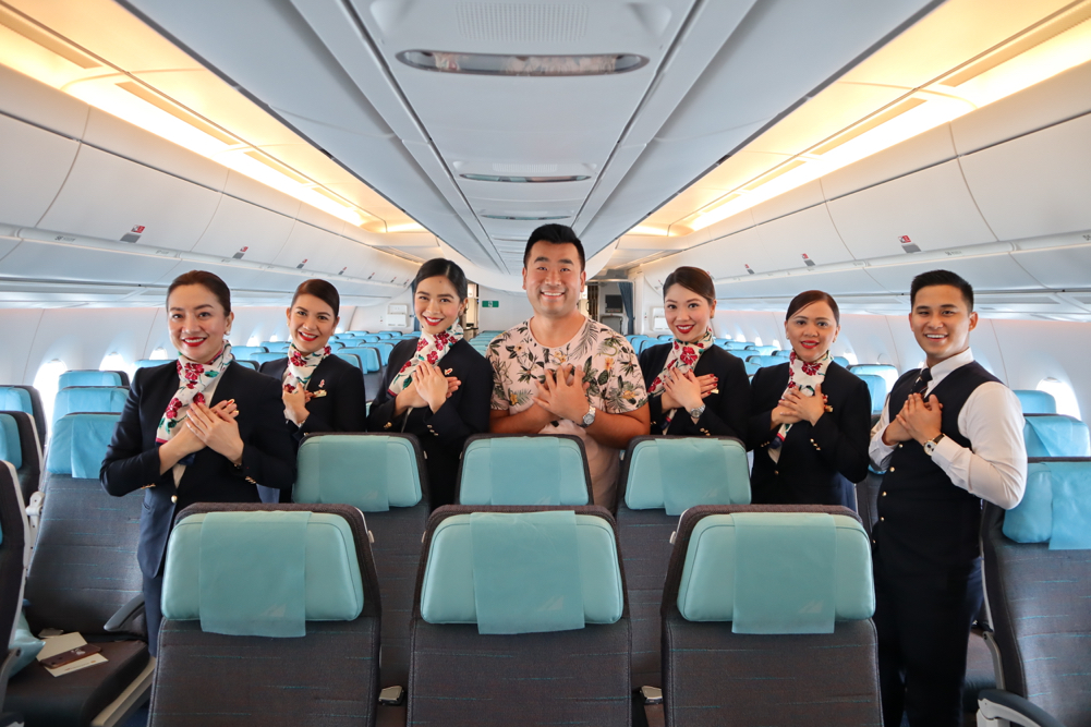 a group of people in a row of seats