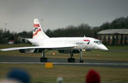 a white airplane on a runway