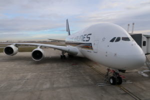 a large white airplane on a runway