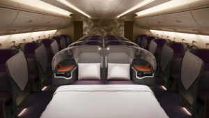 a bed and chairs in a plane