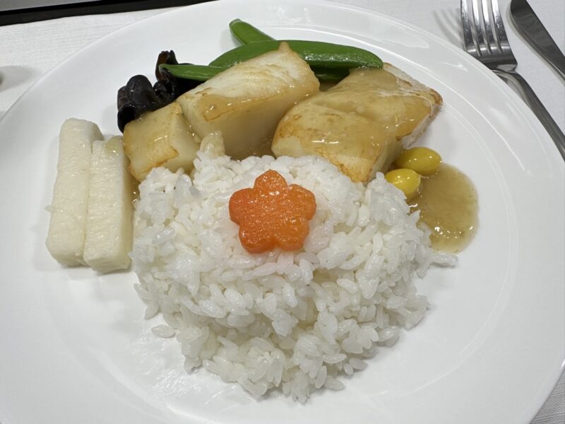 a plate of food on a white surface