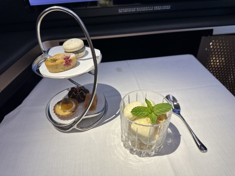 a tray with food on it and a spoon