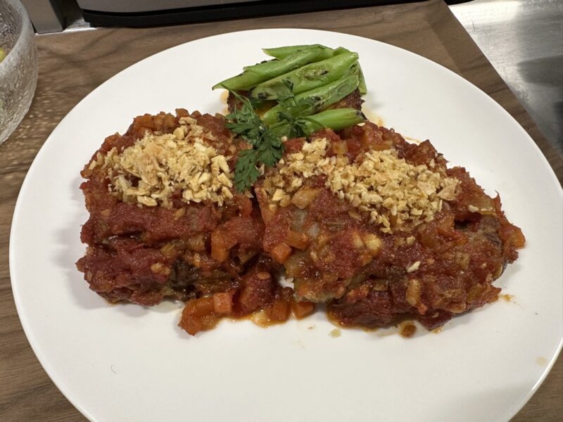 a plate of food on a wood surface