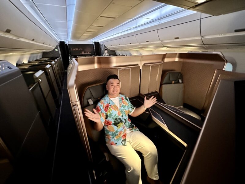 a man sitting in a chair in a plane