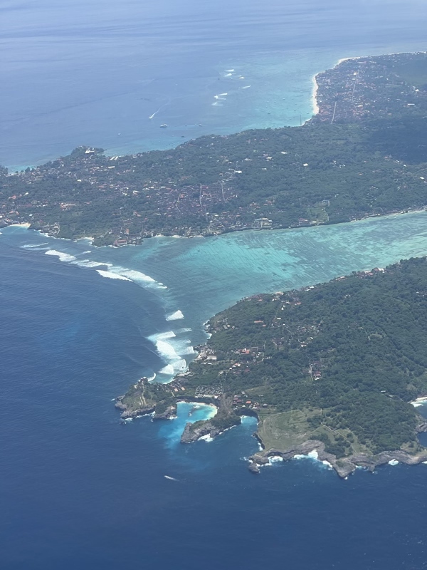 an aerial view of a body of water and land