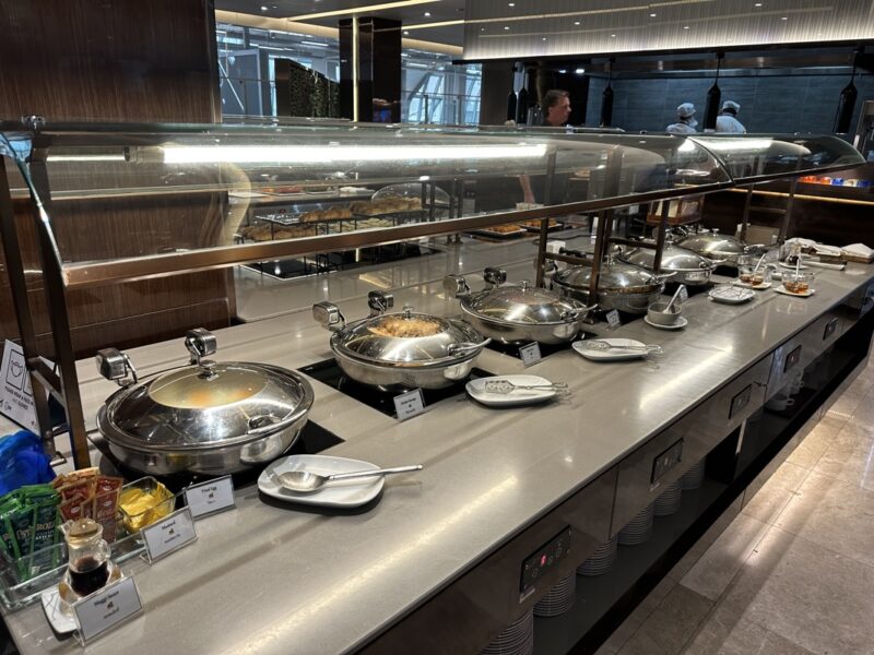 a buffet line with food on the counter