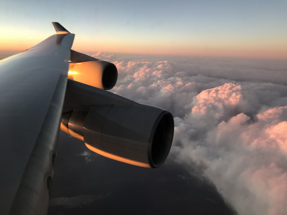 United Airlines B747-400 flying into sunset