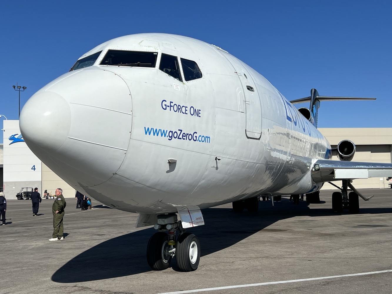 a large white airplane on a tarmac