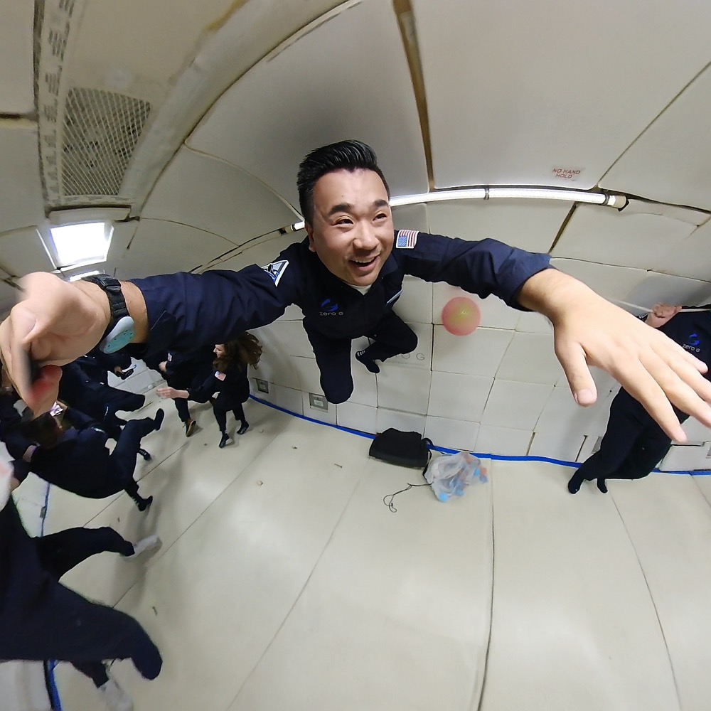 a man in uniform jumping in a room