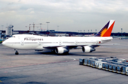 a large white airplane on a runway